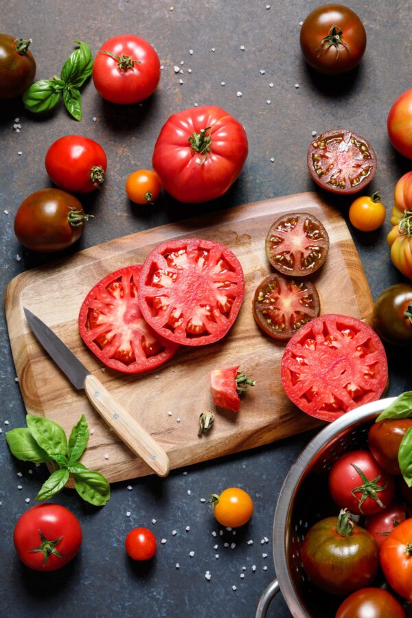 Fresh colorful ripe fall or summer heirloom variety tomatoes wit Pomodoro German Queen semi